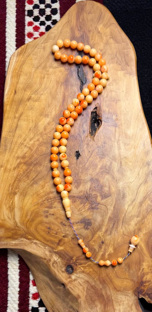 A prayer bead with a clasp