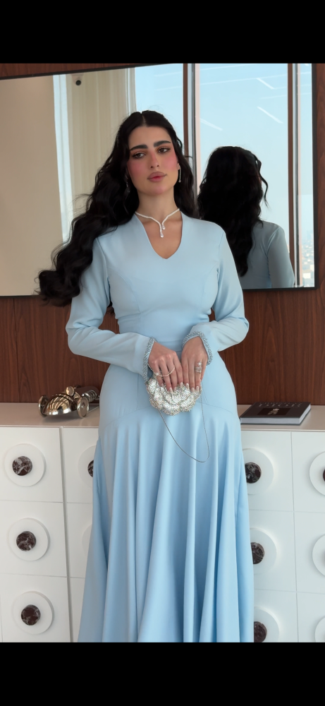 Dress made of Indonesian crepe fabric with hand embroidery on the sleeves, length 58, and back 60