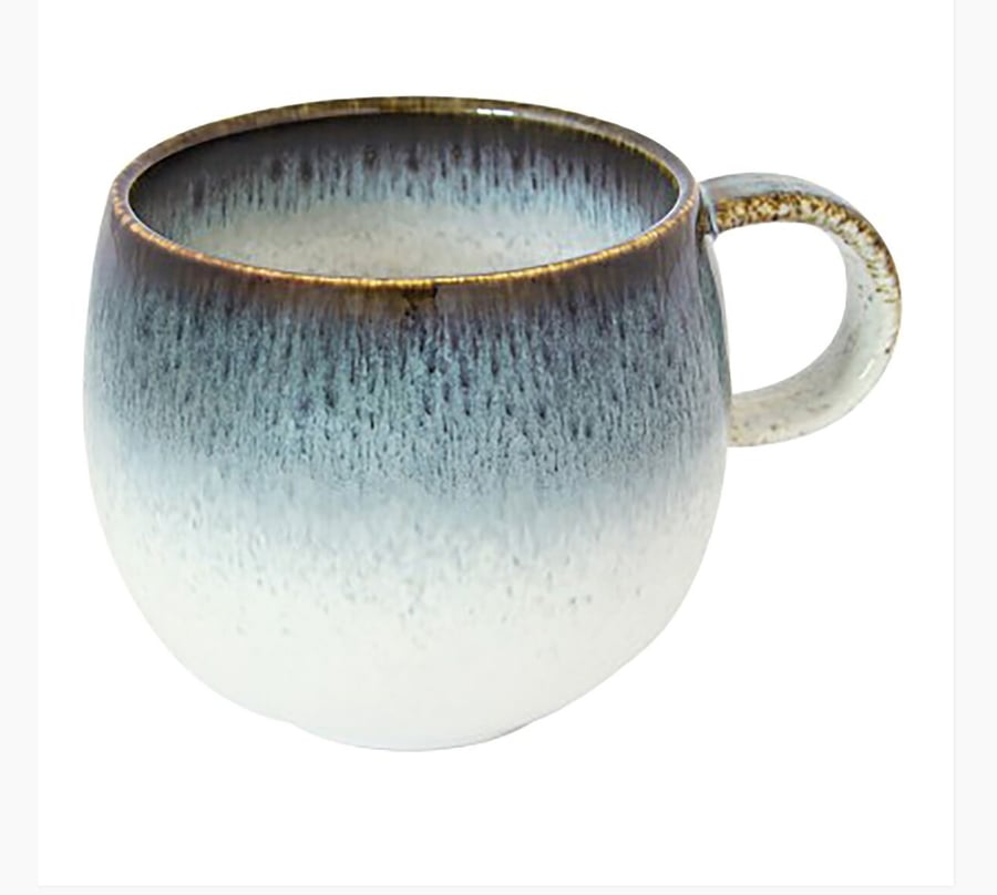 A round porcelain cup in blue and white.