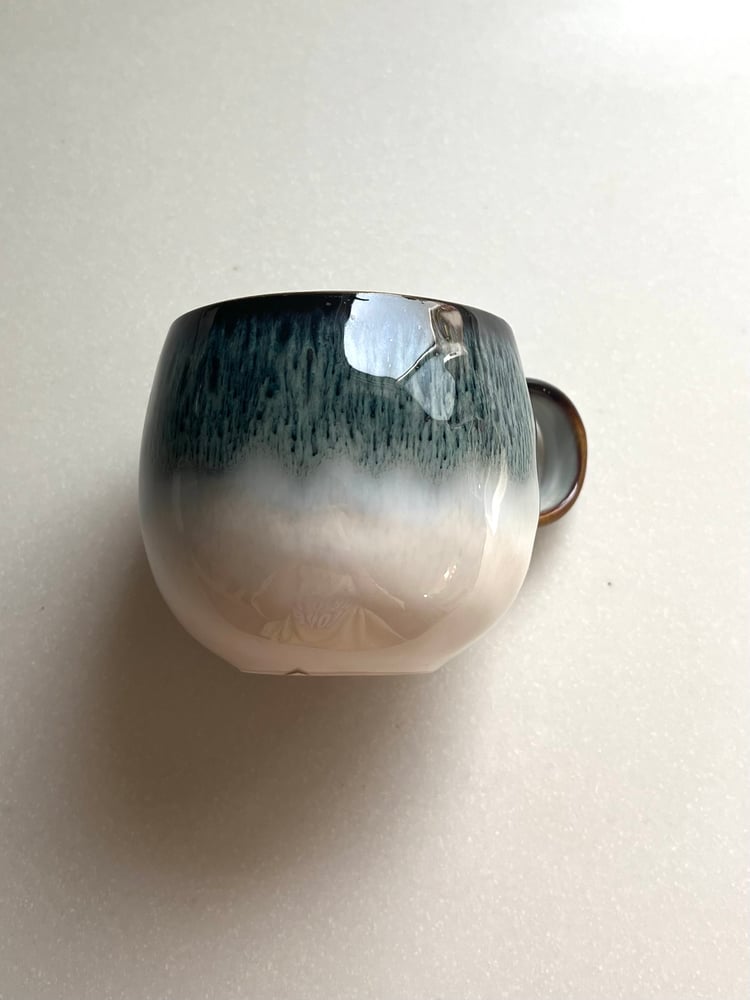 A round porcelain cup in blue and white.