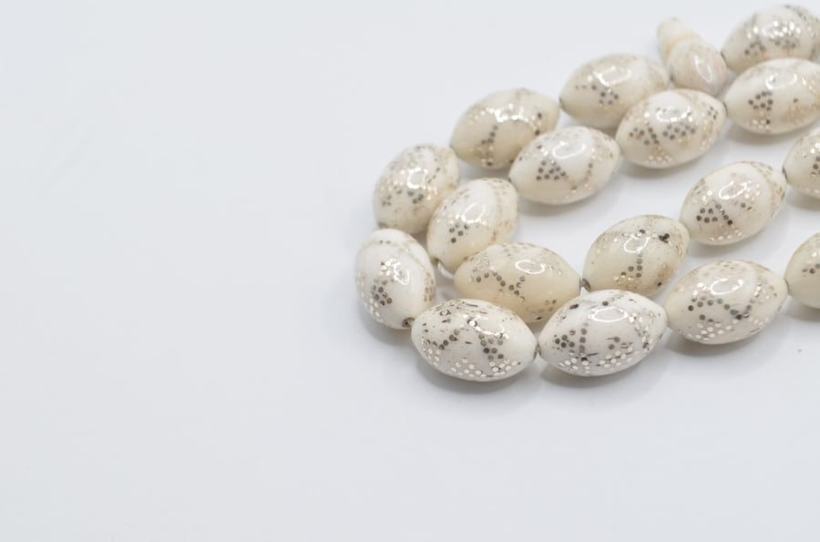 A prayer bead made of bone, plated entirely with silver, Egyptian engraving