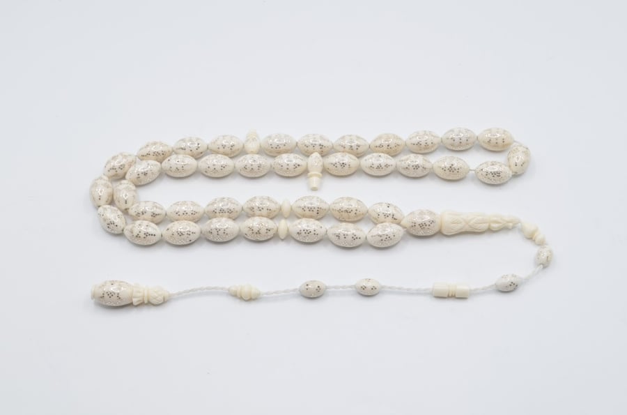 A prayer bead made of bone, plated entirely with silver, Egyptian engraving