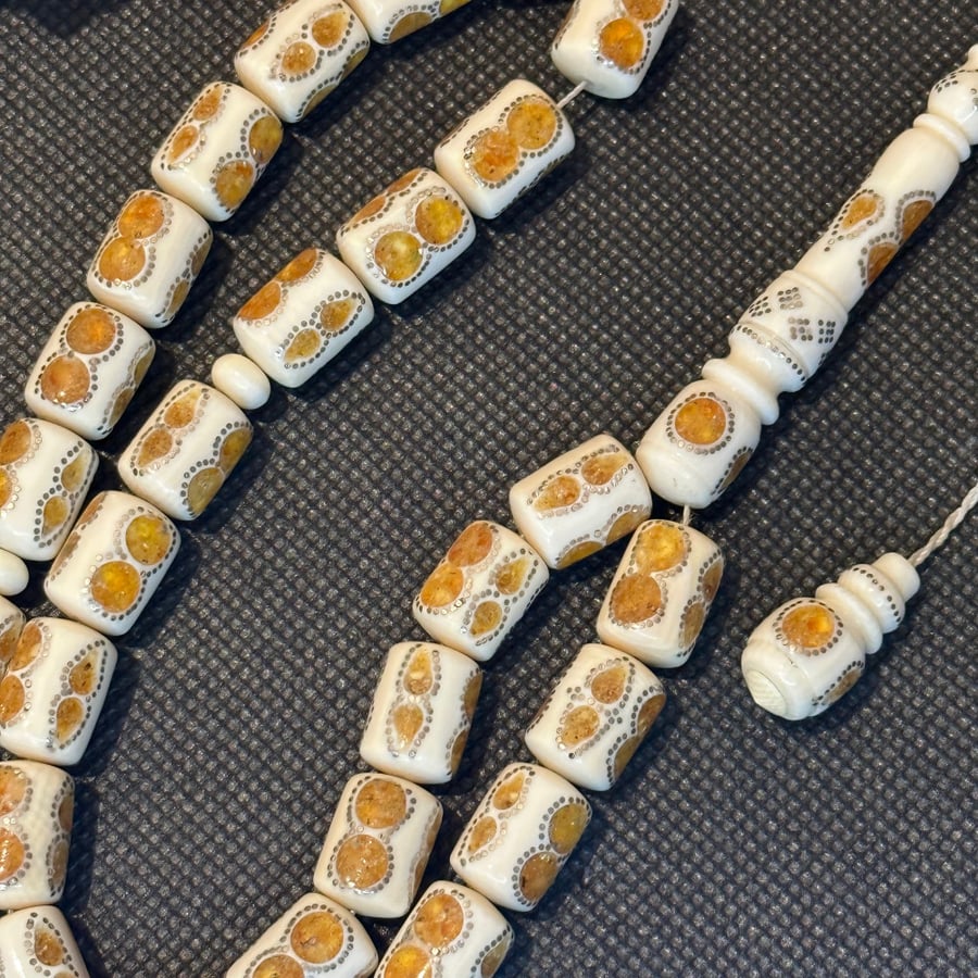 Elephant ivory prayer bead, with amber and silver accents