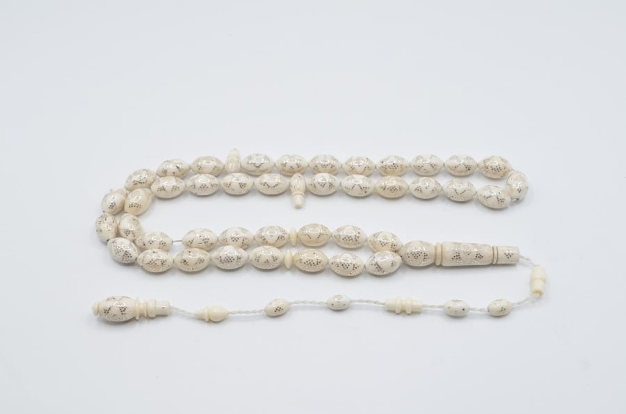 A prayer bead made of bone, plated entirely with silver, Egyptian engraving
