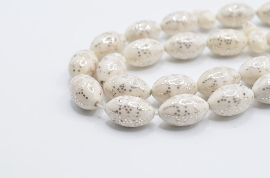 A prayer bead made of bone, plated entirely with silver, Egyptian engraving