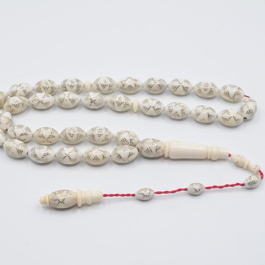 A prayer bead made of bone, plated entirely with silver, Egyptian engraving