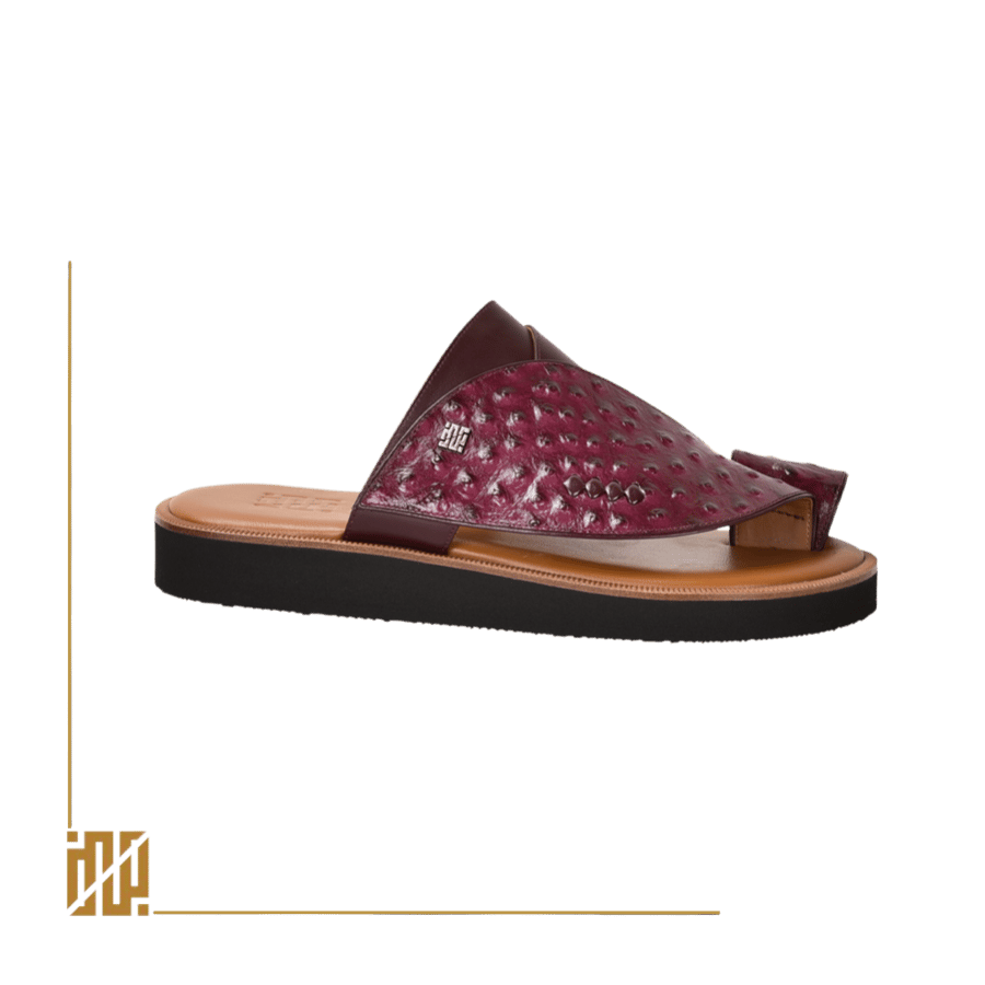 A shoe in the style of ostrich leather in burgundy color