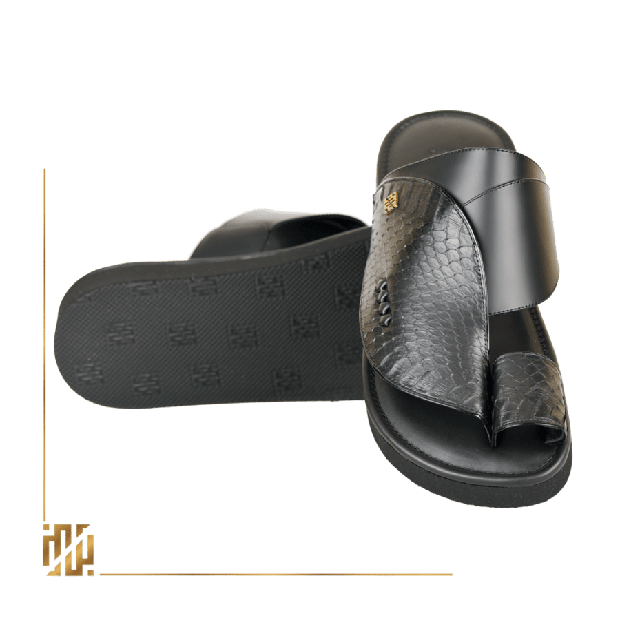 A shoe made of snake leather, black in color