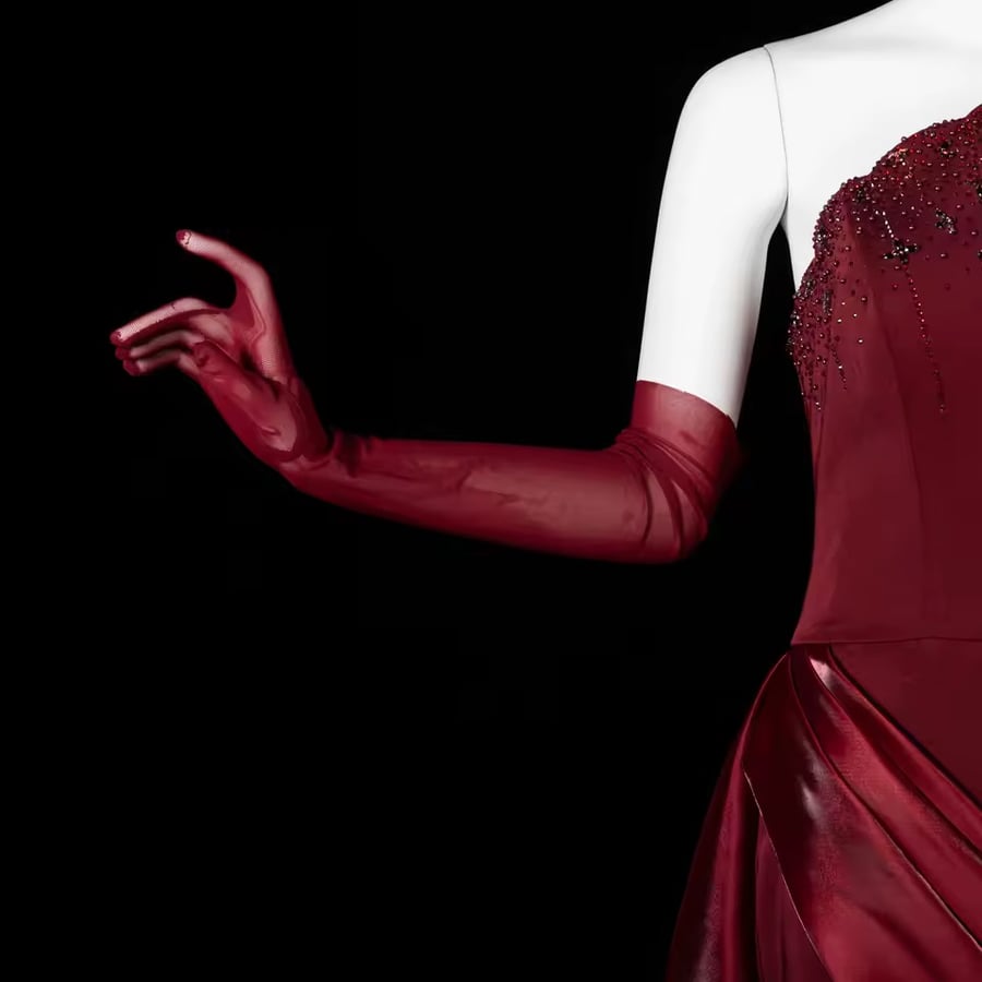 Elegant evening dress without shoulders with an external arm glove