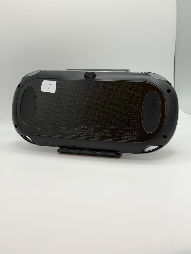 PS Vita OLED — Crystal Black (مع الشاحن)