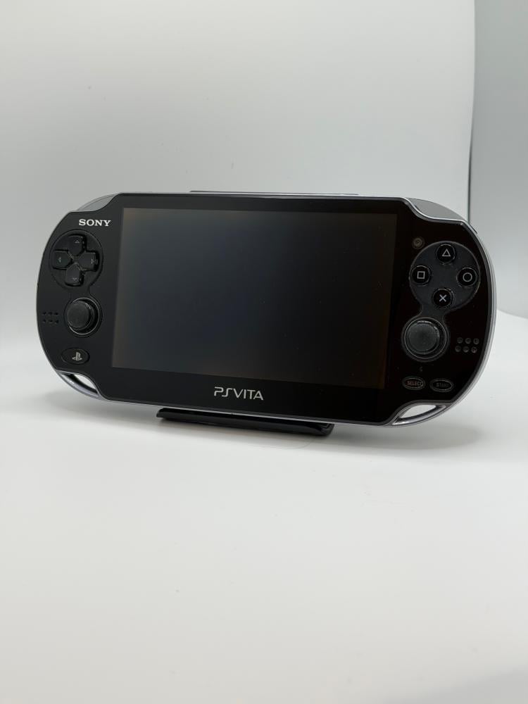 PS Vita OLED — Crystal Black (مع الشاحن)