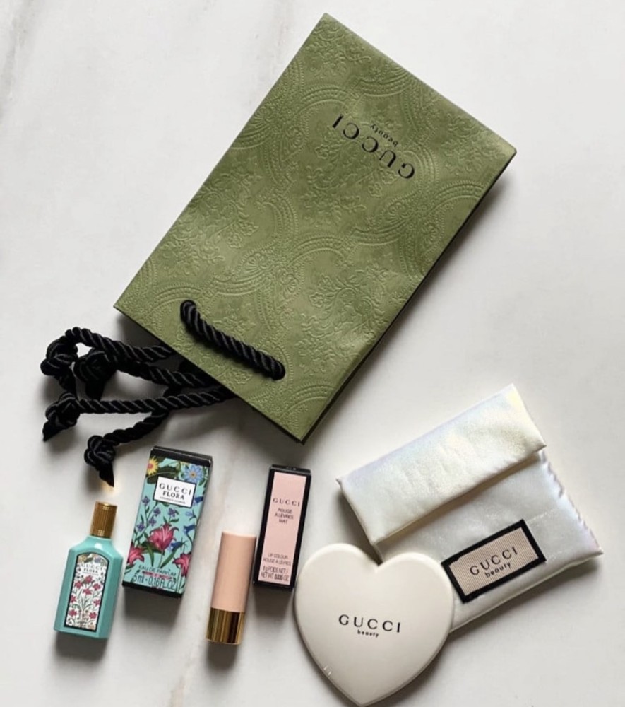 Gucci set contains a leather case with mirror + small lipstick + small perfume + Gucci bag