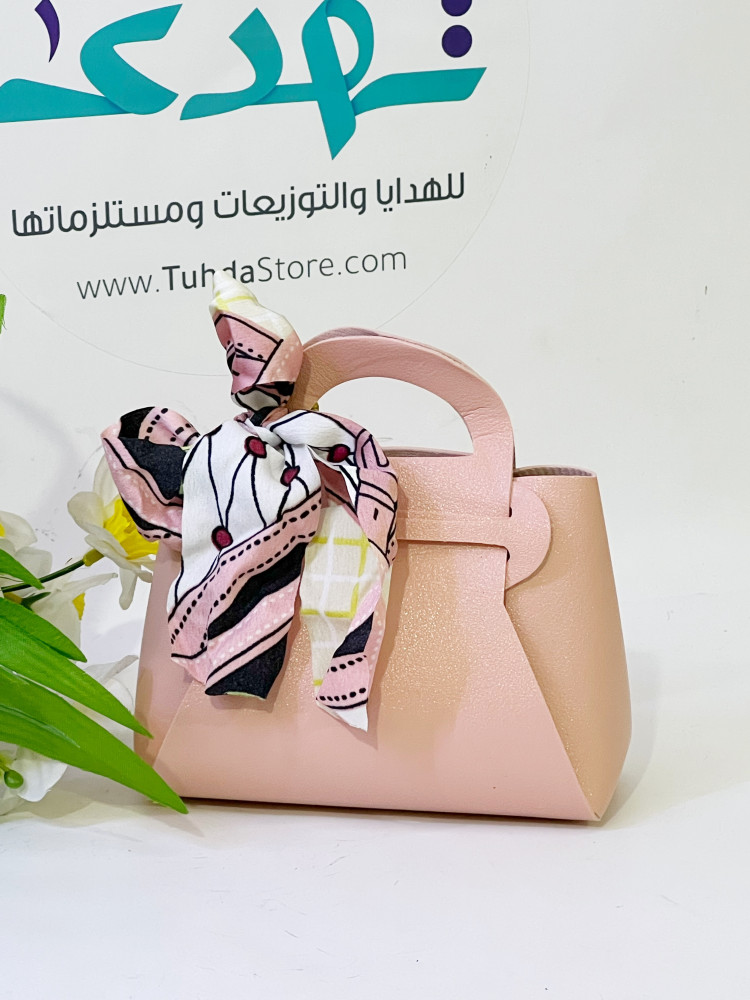 شنطة جلد وردي