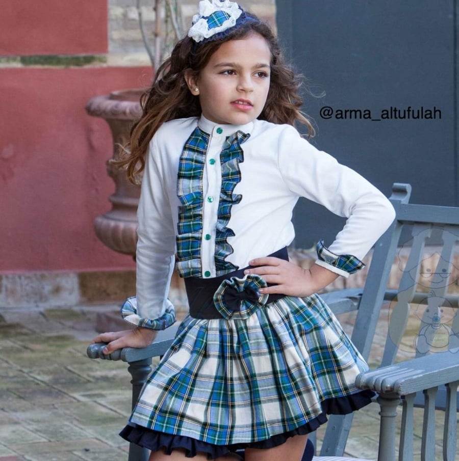 A navy blue skirt set with checks