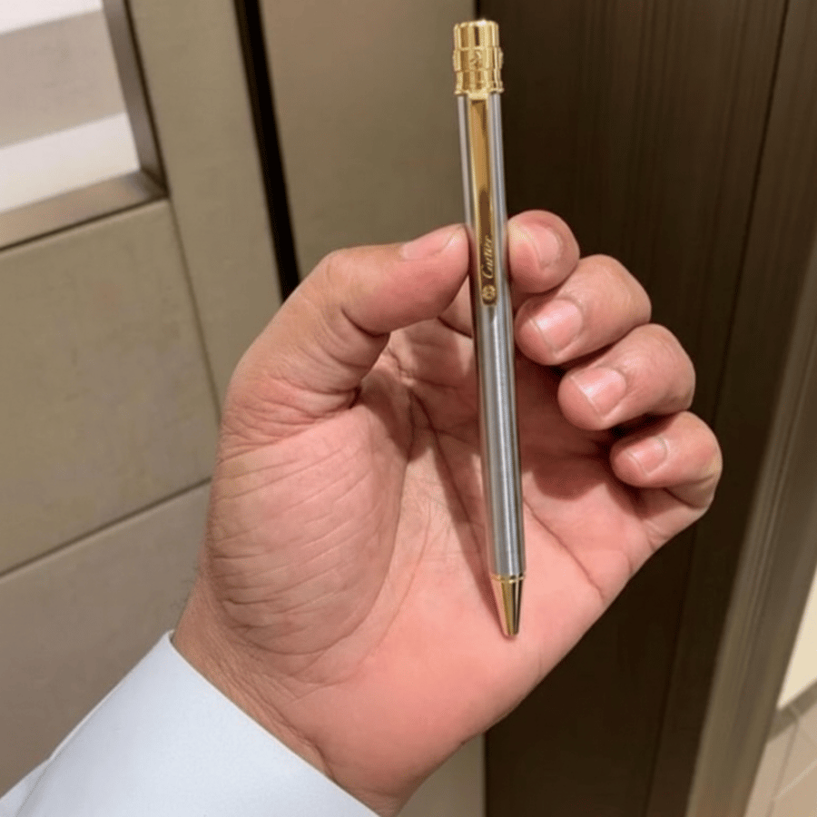 قلم فضي وذهبي Cartier