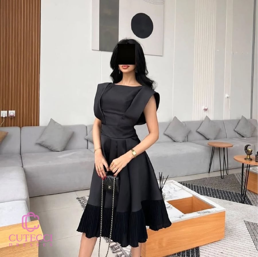 فستان سهرة أسود ميدي بكم مميز وتنورة بكسرات ميكادو أنيقة