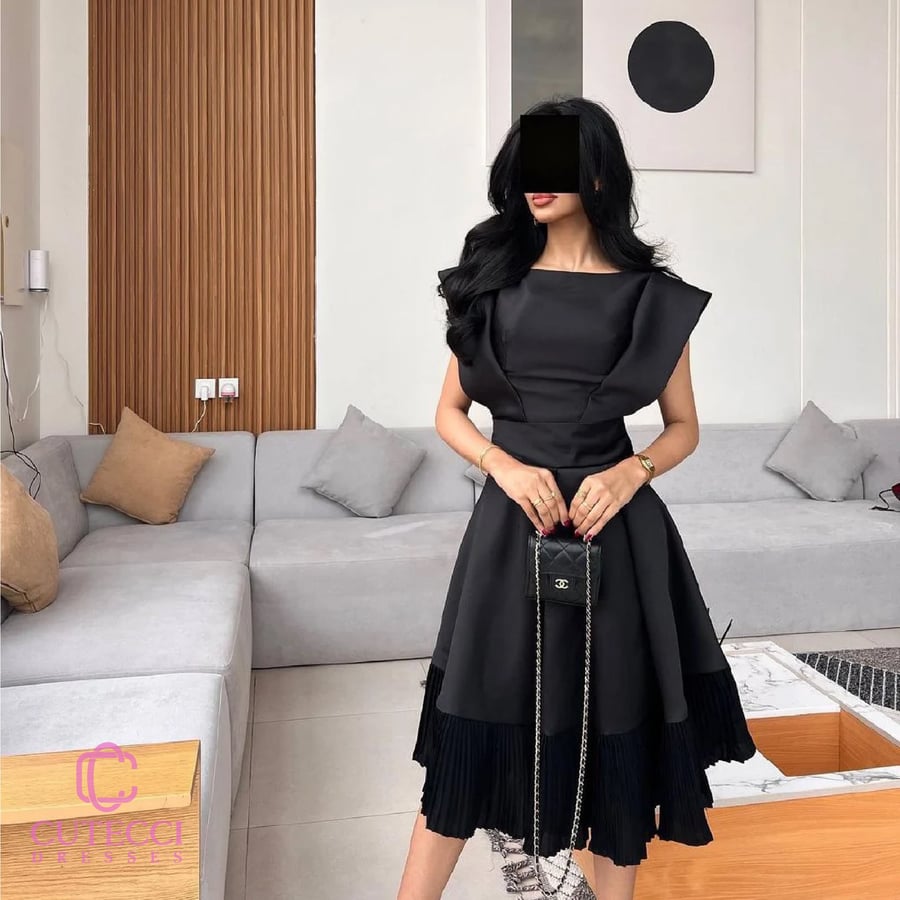 فستان سهرة أسود ميدي بكم مميز وتنورة بكسرات ميكادو أنيقة
