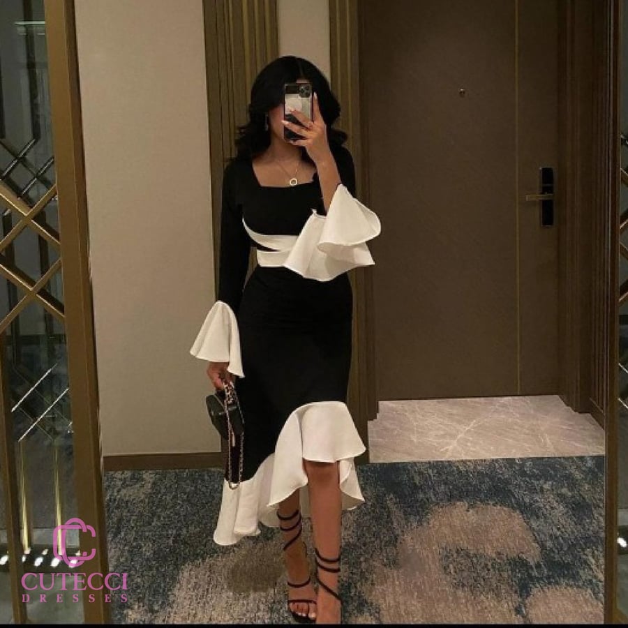 فستان كريب اسود بلمسات بيضاء ناعمة فساتين سهرة فخمة