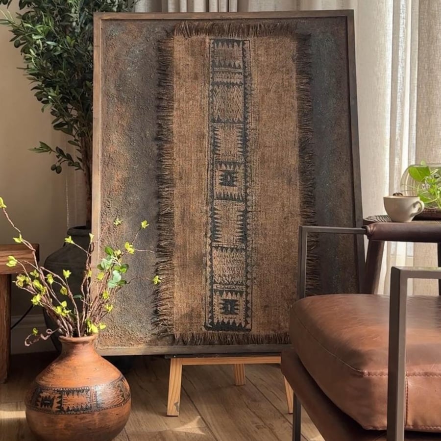 An antique heritage painting with rust colors and burlap