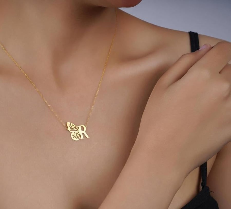 Letter pendant with the butterfly in an elegant design reflecting your elegance