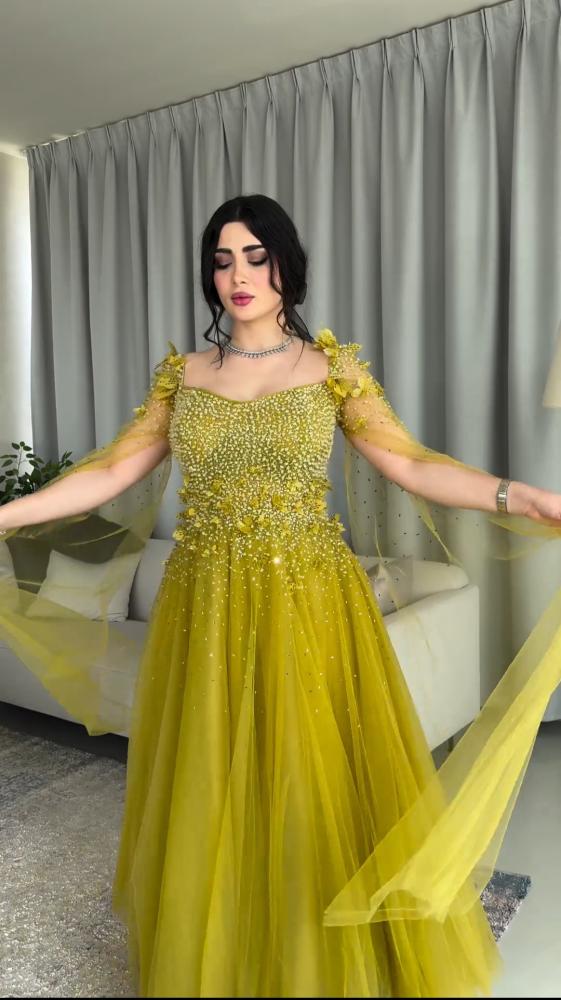 فستان سهره تل المزين بالكثير من اللول بشكل مثالي والورود اليزر