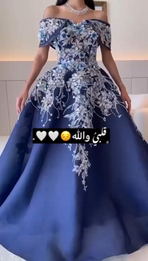 فستان سهره جازار دبل كلوش المزين بالتطريز اليدوي والورود