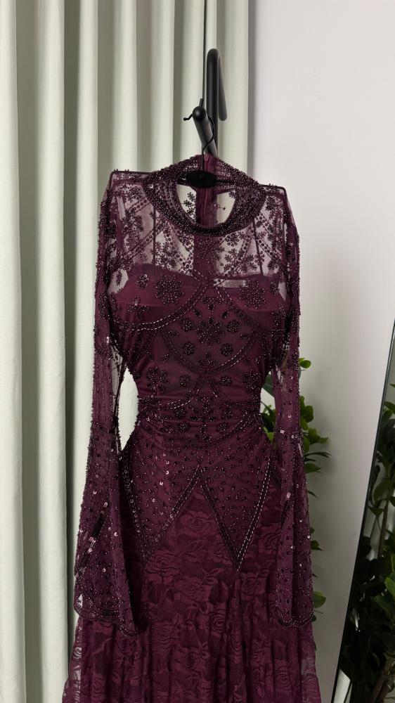 Lace dress decorated with hand embroidery