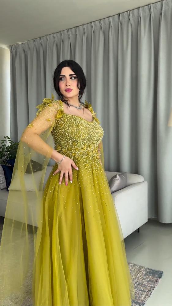 فستان سهره تل المزين بالكثير من اللول بشكل مثالي والورود اليزر