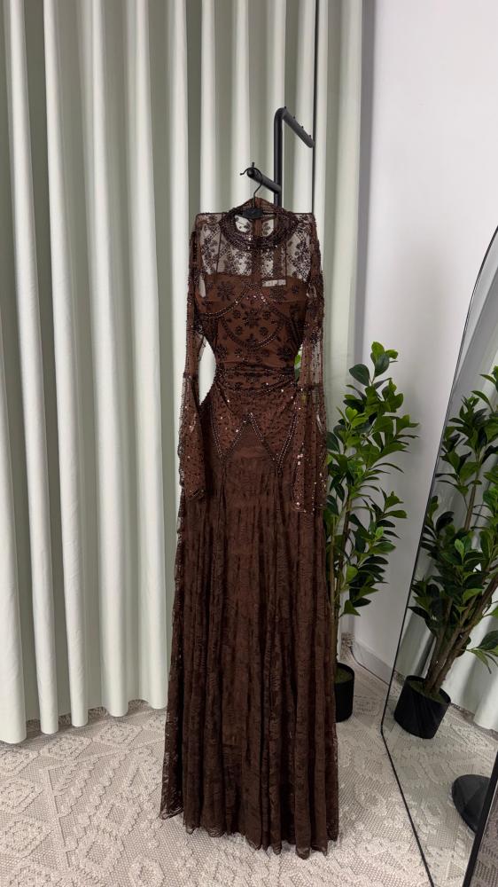 Lace dress decorated with hand embroidery
