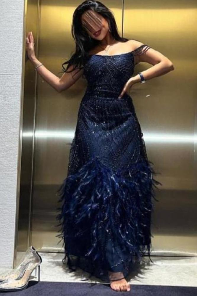 Evening dress decorated with embroidery and feathers