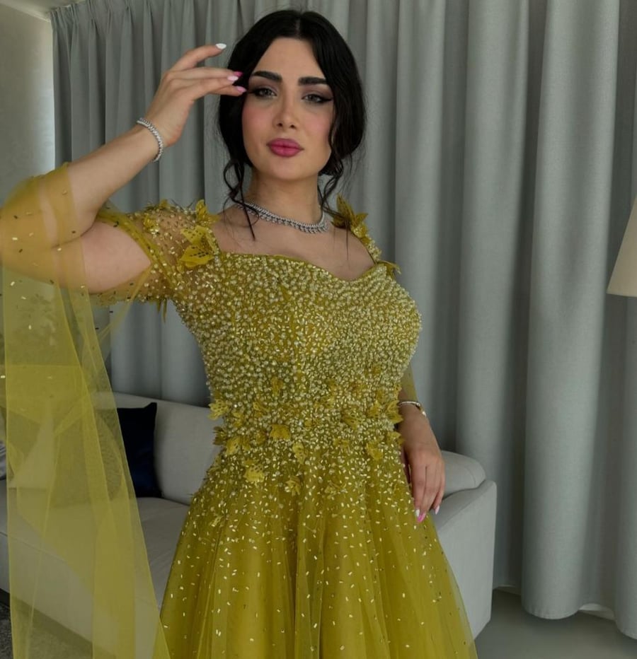 فستان سهره تل المزين بالكثير من اللول بشكل مثالي والورود اليزر