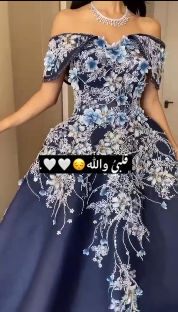 فستان سهره جازار دبل كلوش المزين بالتطريز اليدوي والورود