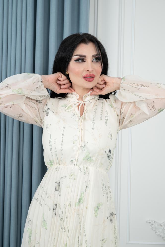 فستان فخم الوهم الساحر يعكس النقوش الرقيقة التي تخلق مظهرا ساحرا وعصريا