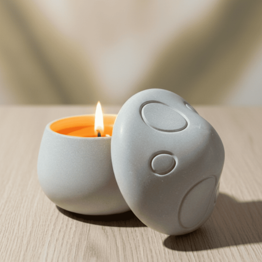 A candle inside a mold in the shape of a mushroom