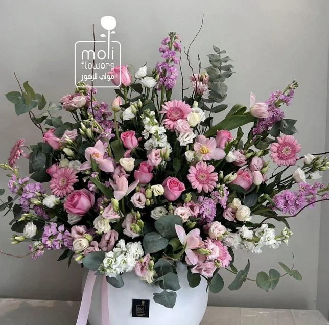 Large plastic vase and Dutch flower arrangement