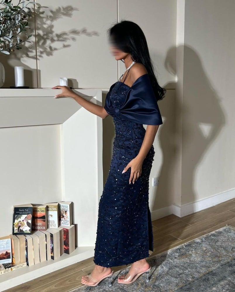 A dress embroidered in navy blue