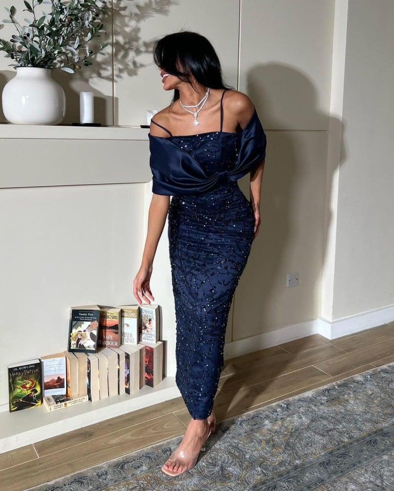 A dress embroidered in navy blue