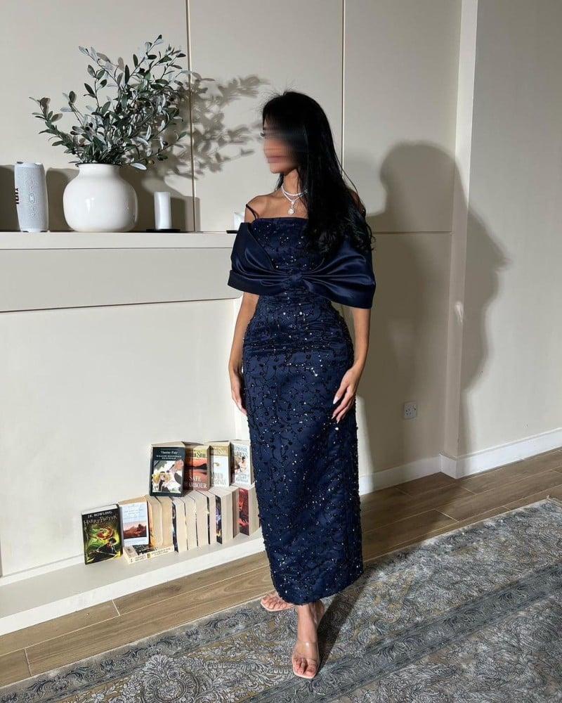A dress embroidered in navy blue