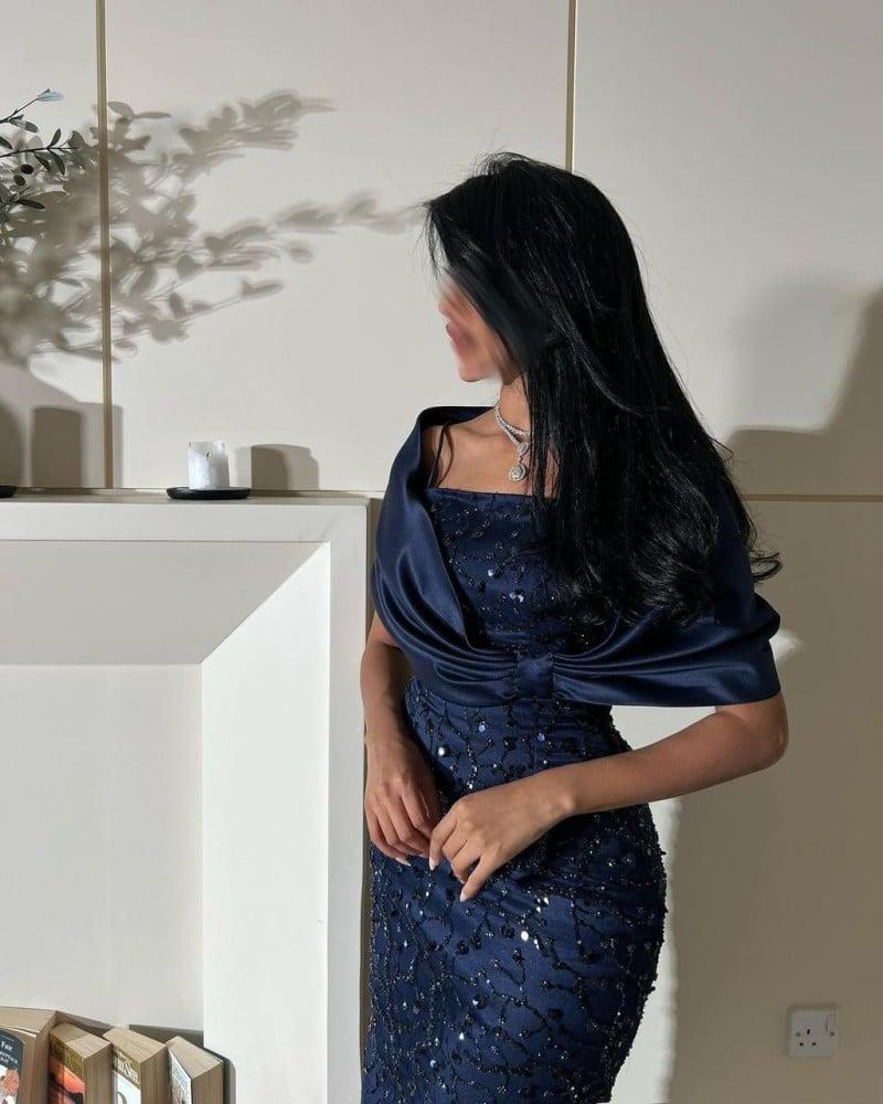 A dress embroidered in navy blue