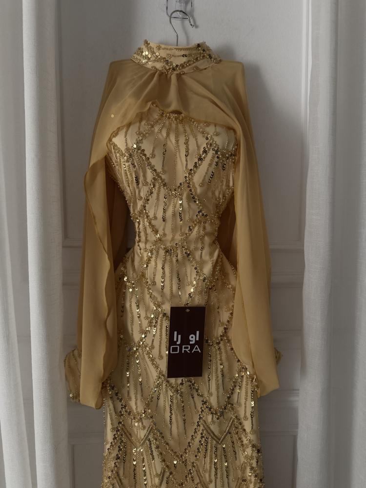 A gold dress with sequins and a separate georgette jacket