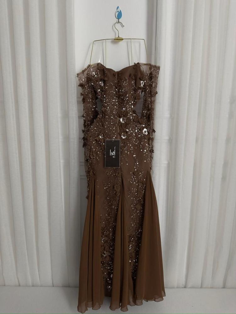 A brown dress with a floral print and georgette insert.
