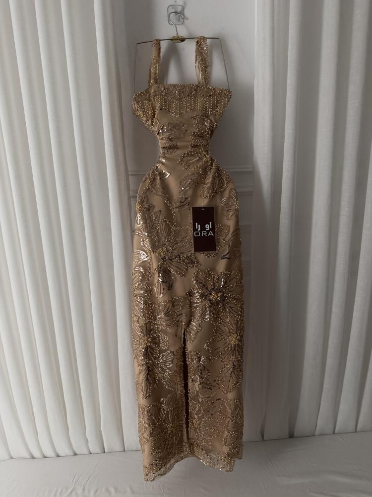 A dress with gold beading