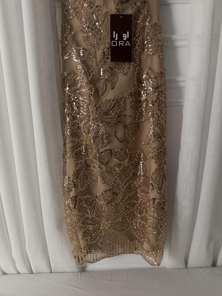 A dress with gold beading