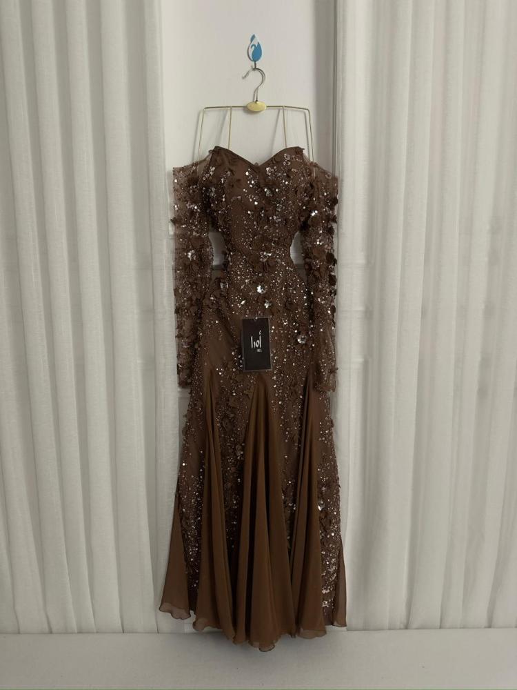 A brown dress with a floral print and georgette insert.