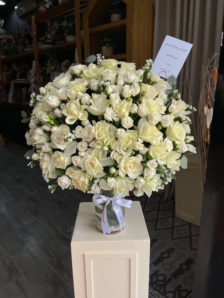 Large flower vase with luxurious arrangement of the gardenia and cherry