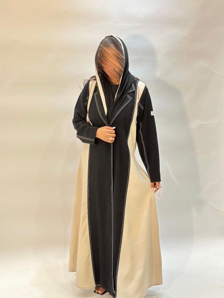عبايه اسود على بيج دق ابيض