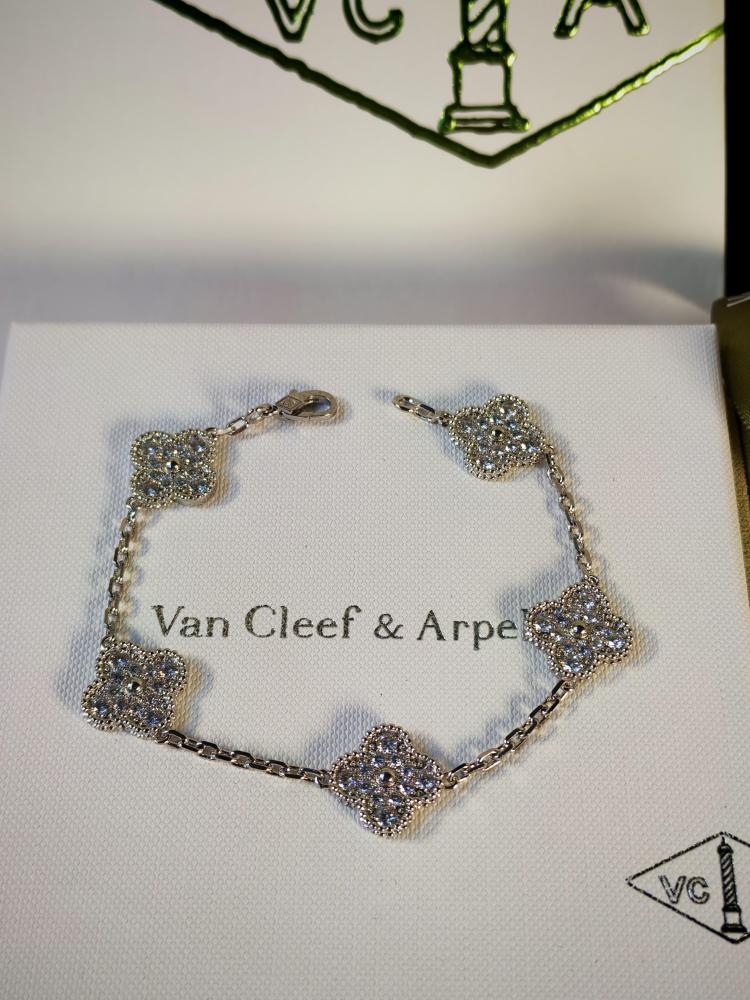 A women's bracelet of a well-known brand with printed accessories