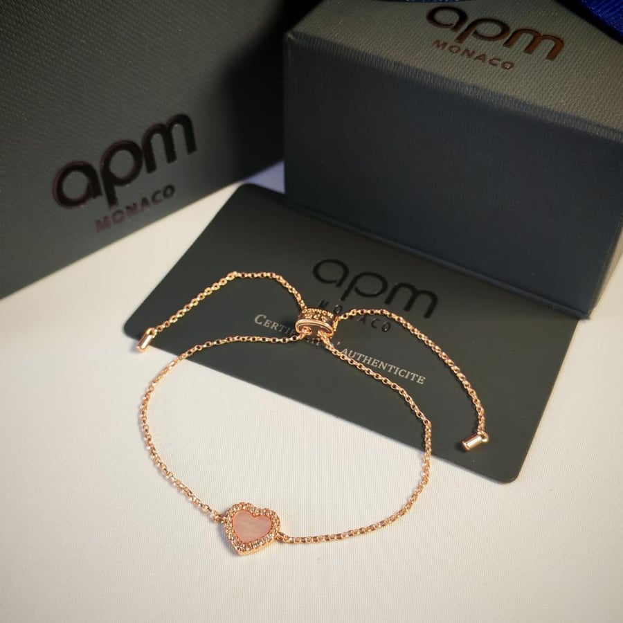 A women's bracelet of a well-known brand with printed accessories