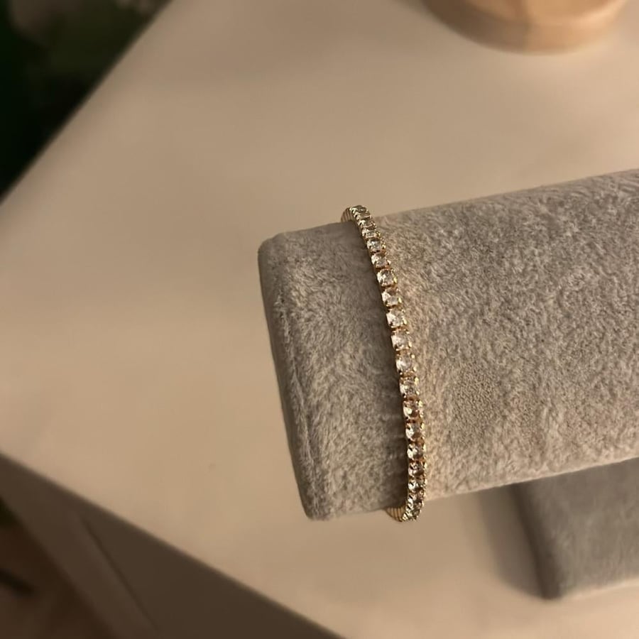 Package of earrings, necklace, and bracelet, Chanel tennis, gold