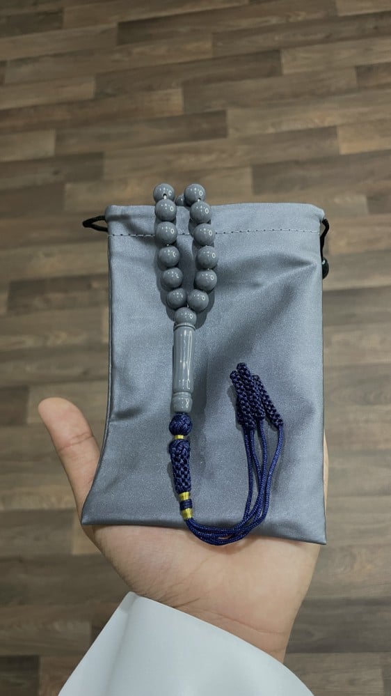 A holder for prayer beads